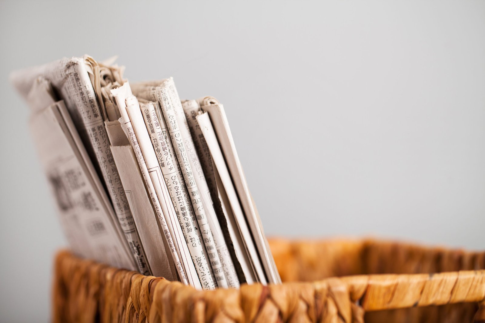 Closeup image of magazines in a straw pleated  box